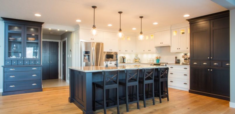 FILE #: 193357700 Preview Crop Find Similar Custom kitchen with built in appliances, hard wood floors, and light and dark cabinetry
